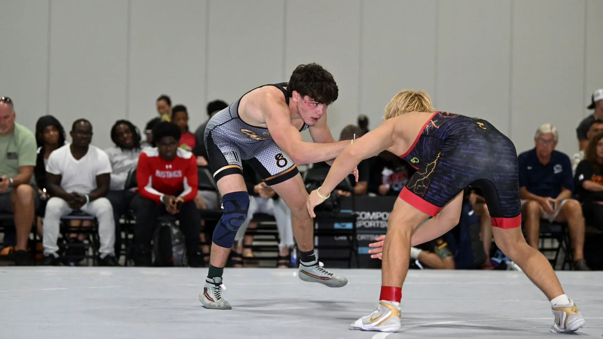 Montage of wrestlers competing in custom Compound sublimated singlets